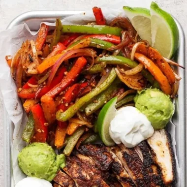 Sizzling Blackstone chicken fajitas with colorful peppers and onions
