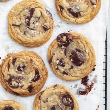 Delicious chewy chocolate chip cookies freshly baked on a cooling rack