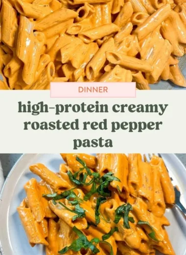 Creamy roasted red pepper pasta served in a bowl, topped with fresh herbs.