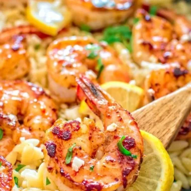 One-pot orzo with shrimp and feta topped with fresh herbs and lemon