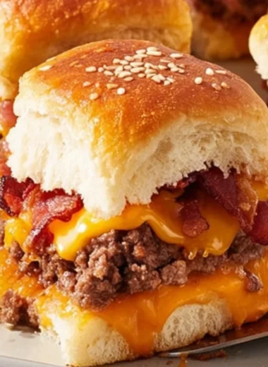 Bacon cheeseburger slider bake served on a platter with toppings