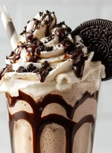 Delicious Bailey's Cookies and Cream Shake topped with whipped cream and cookie crumbs.