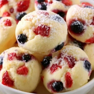 Delicious berry protein pancake bites stacked on a plate