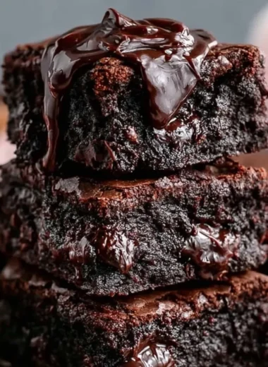 Chewy no sugar Greek yogurt brownies on a plate, perfect healthy dessert option.