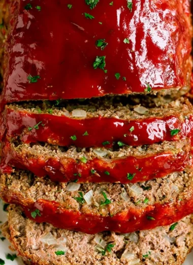 Classic meatloaf served with mashed potatoes and vegetables