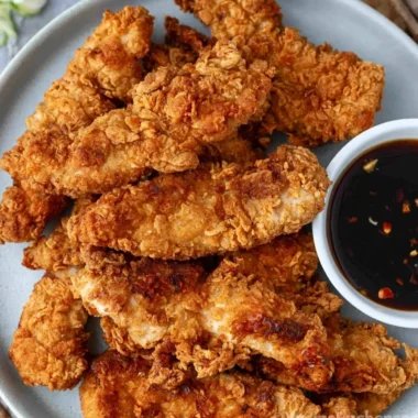 Crispy honey garlic chicken tenders served with a honey dipping sauce