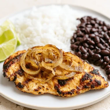 Cuban Grilled Chicken served with fresh sides and vibrant colors