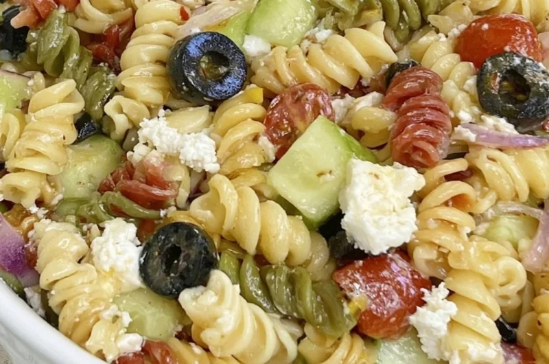 Bowl of easy Italian Pasta Salad with colorful vegetables and dressing