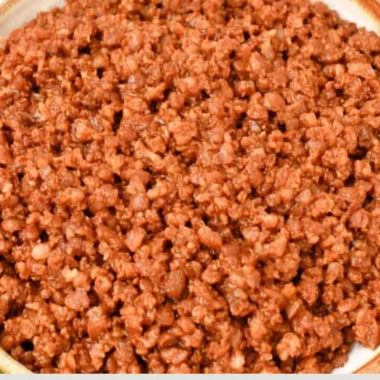 Easy lentil taco meat served in a taco shell with toppings.