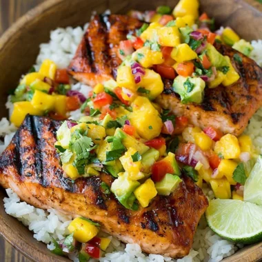 Grilled salmon with mango salsa on a bed of coconut rice.