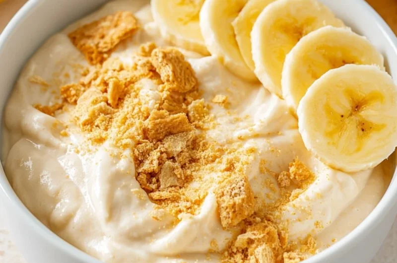 Healthy high protein banana pudding bowl topped with fresh bananas and nuts