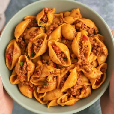 High protein taco pasta served in a bowl with toppings.