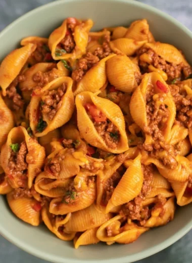 High protein taco pasta served in a bowl with toppings.