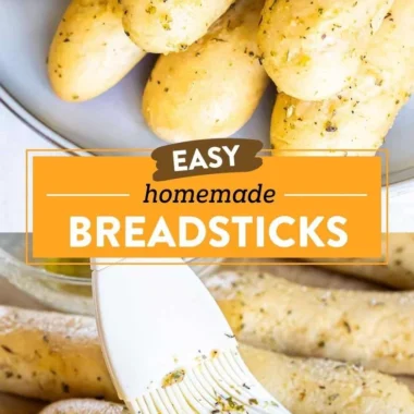 Homemade garlic herb breadsticks arranged on a plate, ready to serve.