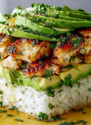 Delicious Honey Lime Chicken Avocado Rice Stack served on a plate