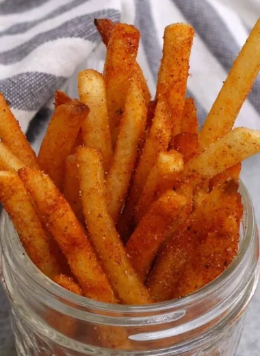 Delicious homemade Popeyes Cajun Fries recipe served hot and crispy.