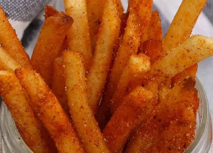Delicious homemade Popeyes Cajun Fries recipe served hot and crispy.