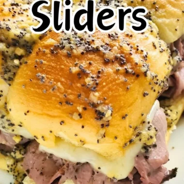 Delicious roast beef sliders served on a platter with condiments and pickles