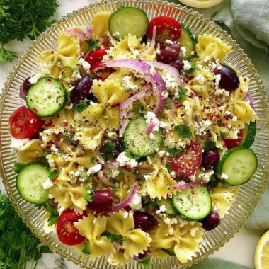 Delicious Tangy Mediterranean Pasta Salad with fresh vegetables and feta cheese