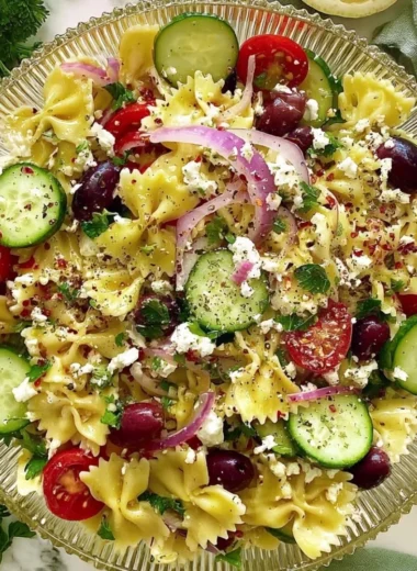 Delicious Tangy Mediterranean Pasta Salad with fresh vegetables and feta cheese