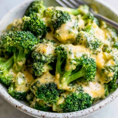 Delicious cheesy broccoli dish topped with melted cheese