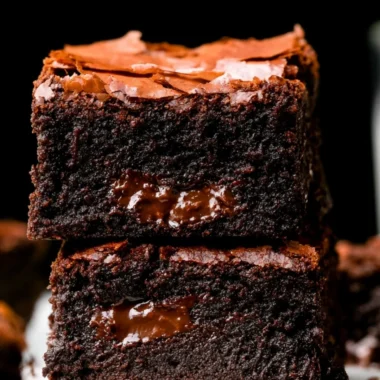 Ultimate fudgy brownies topped with chocolate drizzle and sprinkles