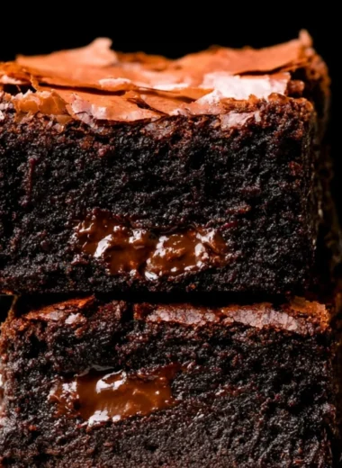 Ultimate fudgy brownies topped with chocolate drizzle and sprinkles