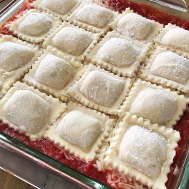 Cozy baked ravioli casserole with melted cheese and marinara sauce.