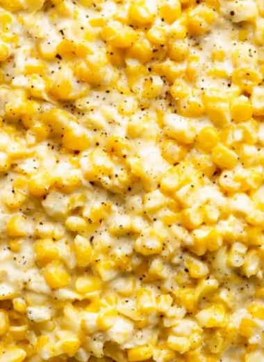 Delicious cozy creamed corn served in a bowl with a golden hue.