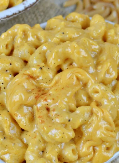 Cozy crock pot macaroni and cheese in a warm serving bowl