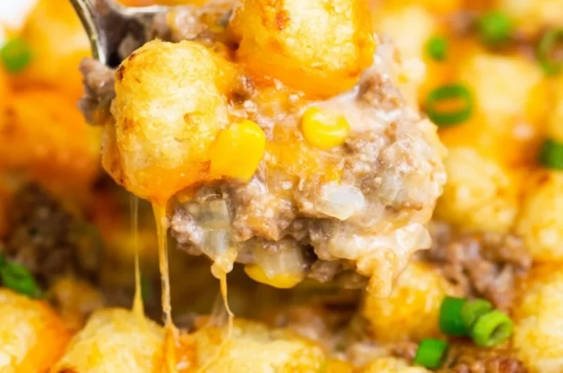 Delicious tater tot casserole topped with crispy tots and cheese, perfect for a cozy meal.
