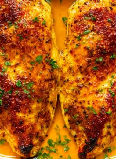 Cozy oven baked chicken breast served with vegetables on a plate