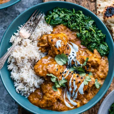 Cozy slow cooker chicken curry dish with spices and ingredients.