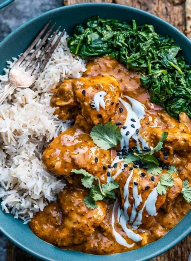 Cozy slow cooker chicken curry dish with spices and ingredients.