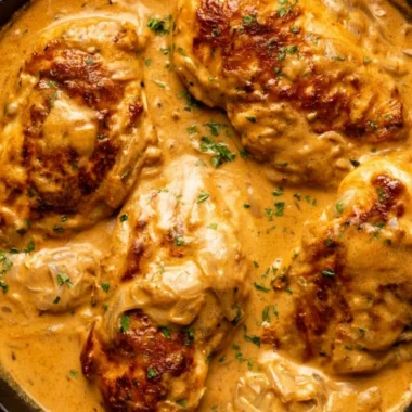 Cozy smothered chicken dish with rich gravy and herbs