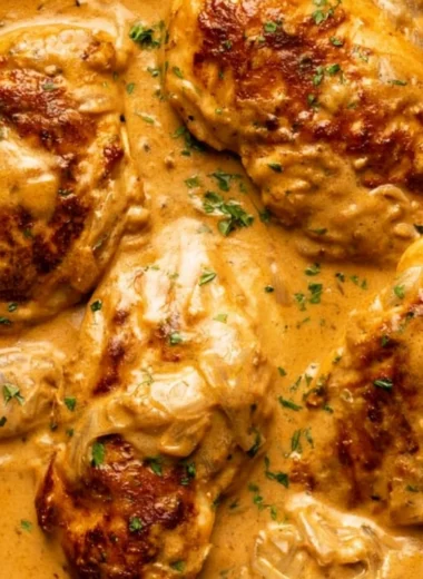 Cozy smothered chicken dish with rich gravy and herbs