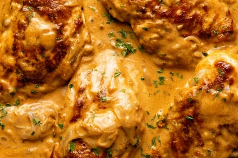 Cozy smothered chicken dish with rich gravy and herbs