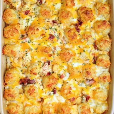 Cracked Out Chicken Tater Tot Casserole topped with cheese and crispy tater tots