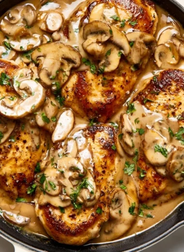 Delicious easy Chicken Marsala with mushrooms and wine sauce served on a plate.