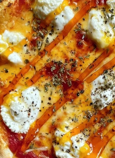 Hot honey ricotta pizza with fresh ingredients and drizzled honey
