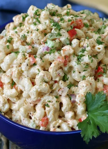 Delicious macaroni salad served in a bowl, perfect for summer picnics.