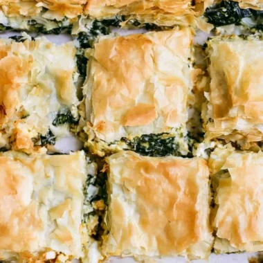 Delicious homemade spinach pie with golden crust and fresh spinach filling