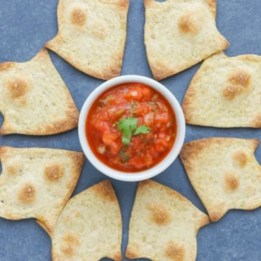 Spooky baked Halloween chips served on a festive platter