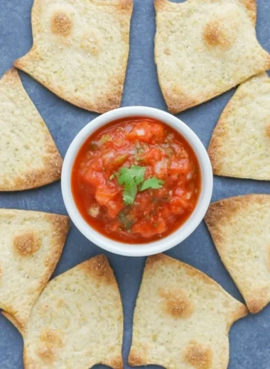 Spooky baked Halloween chips served on a festive platter