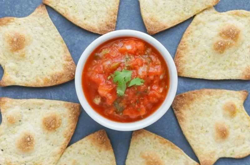 Spooky baked Halloween chips served on a festive platter