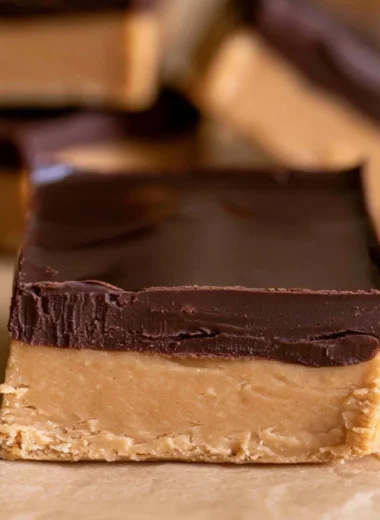 Homemade Buckeye Bars with chocolate and peanut butter topping