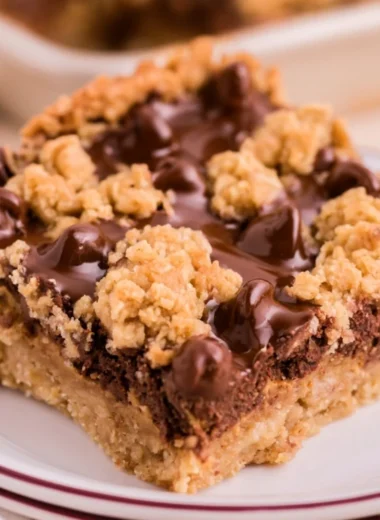 Cozy chocolate peanut butter oatmeal bars on a wooden table with a rustic background