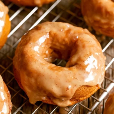 Cozy vegan pumpkin donuts dusted with cinnamon sugar on a plate
