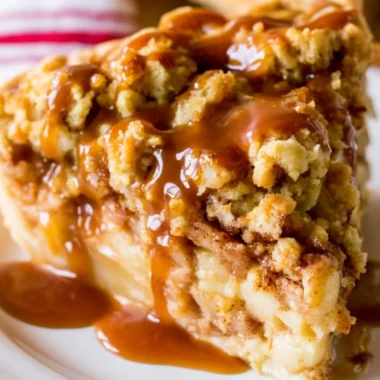Delicious Dutch Caramel Apple Pie with caramel drizzled on top