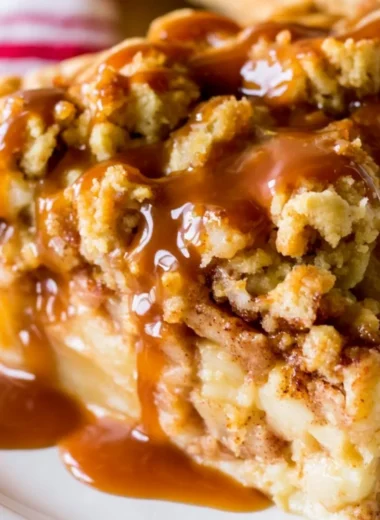 Delicious Dutch Caramel Apple Pie with caramel drizzled on top